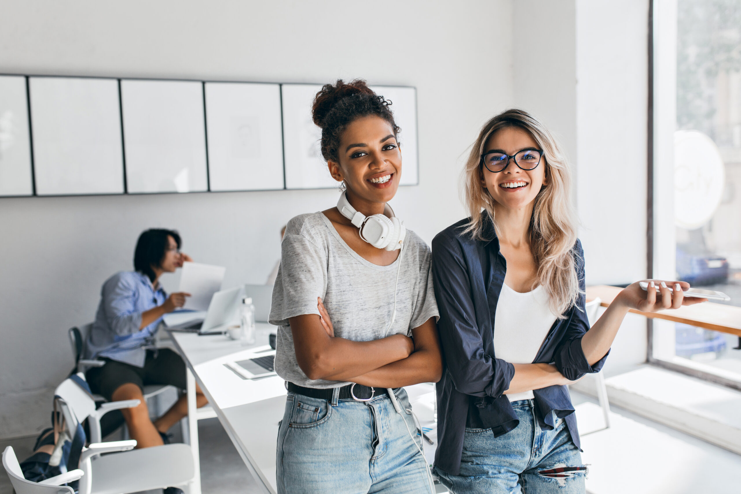 african woman trendy casual attire came friend s office posing with asian programmer charming blonde secretary having fun during break while her japanese colleague working scaled 1